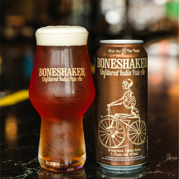 Boneshaker IPA poured fresh in a glass with its can, at Amsterdam Brewhouse with lakeside views and a rooftop setting.